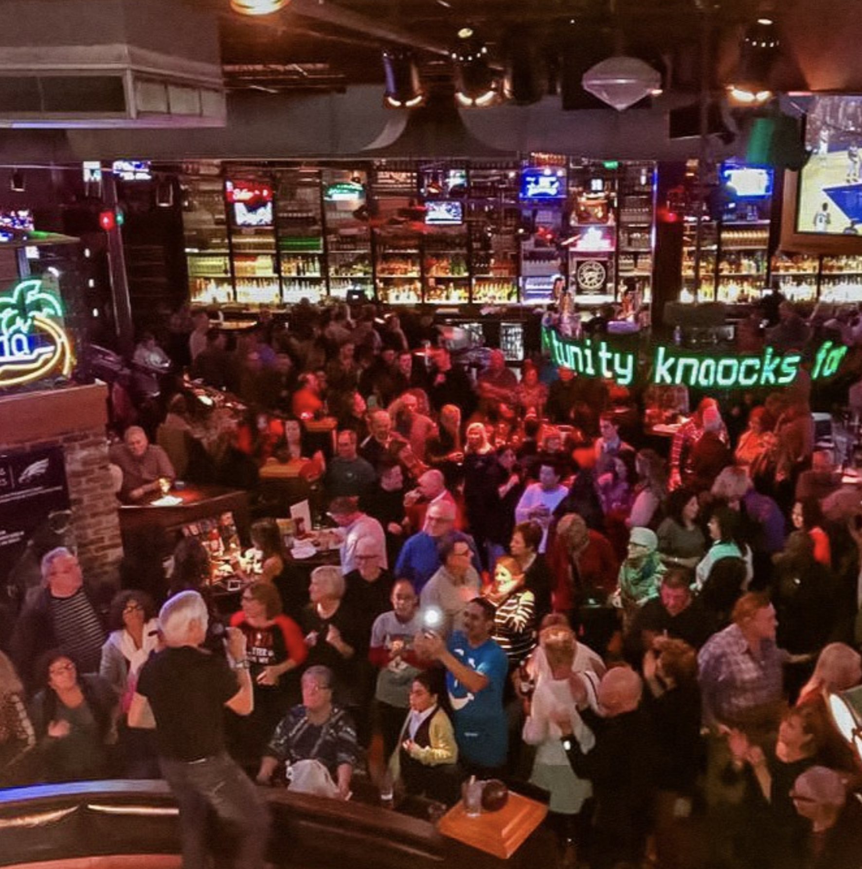 A packed crowd at a sports bar.