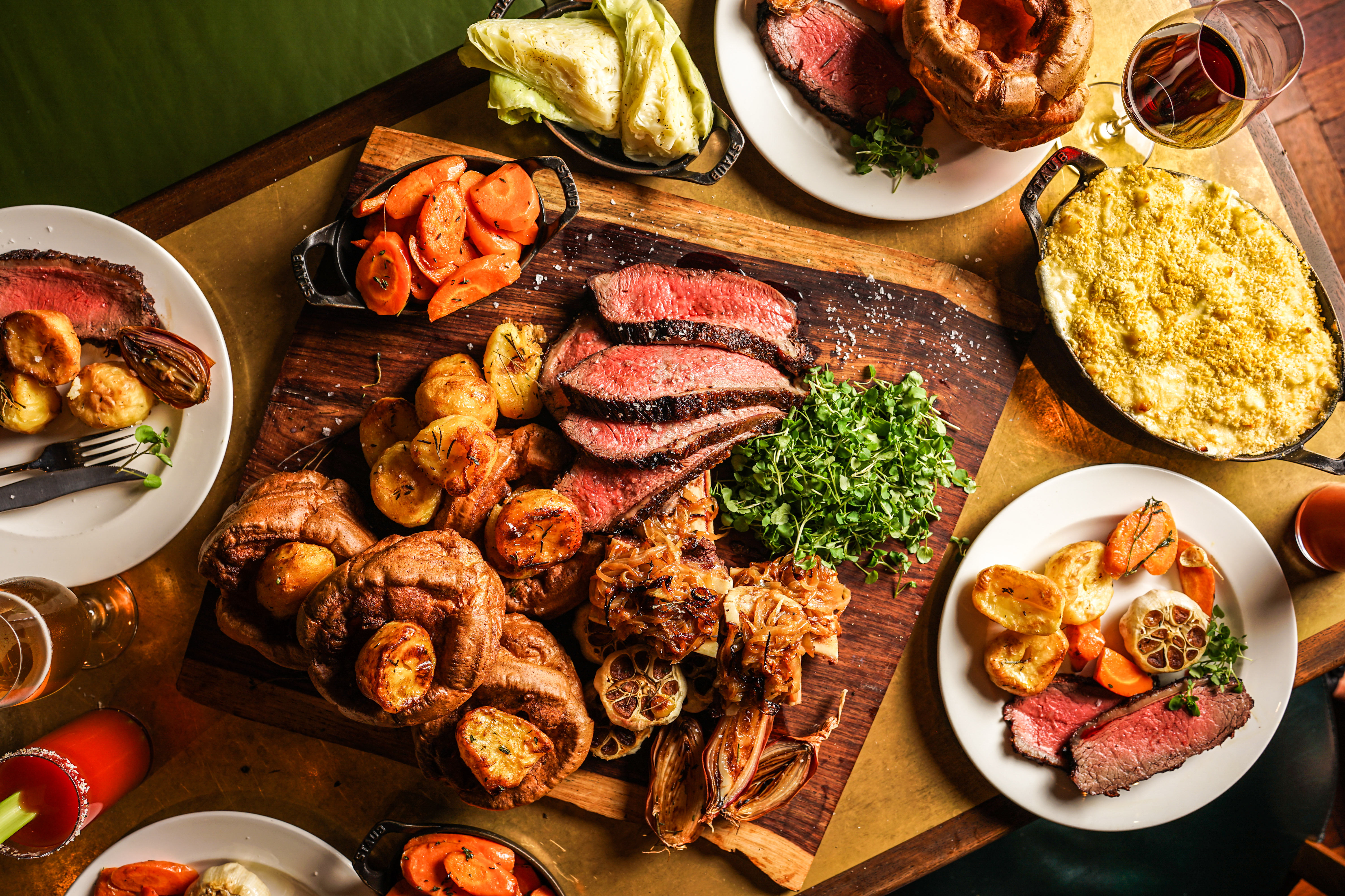 A big spread on a table for a Sunday roast.