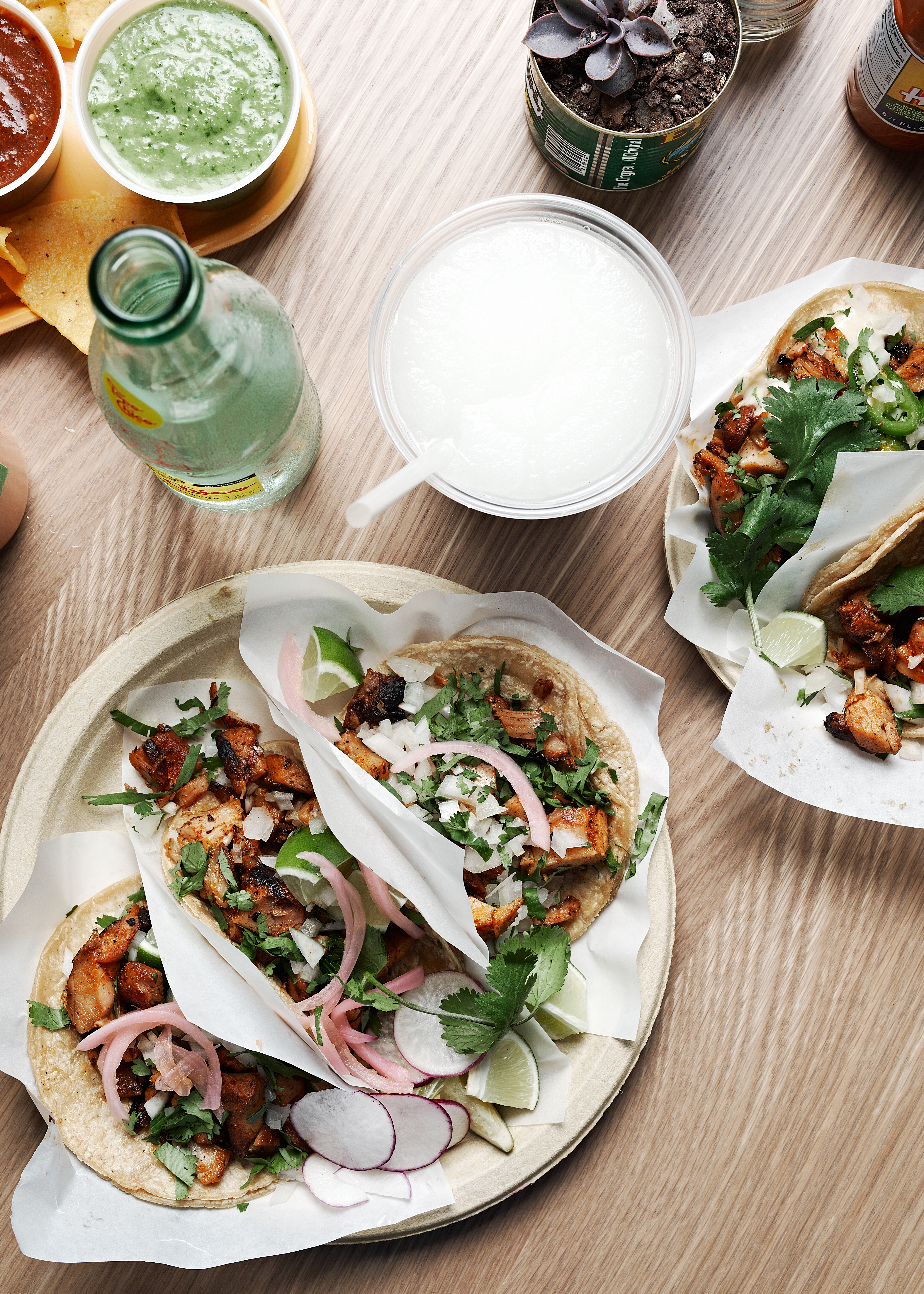 Plates of tacos and agua fresca at Little Rey.