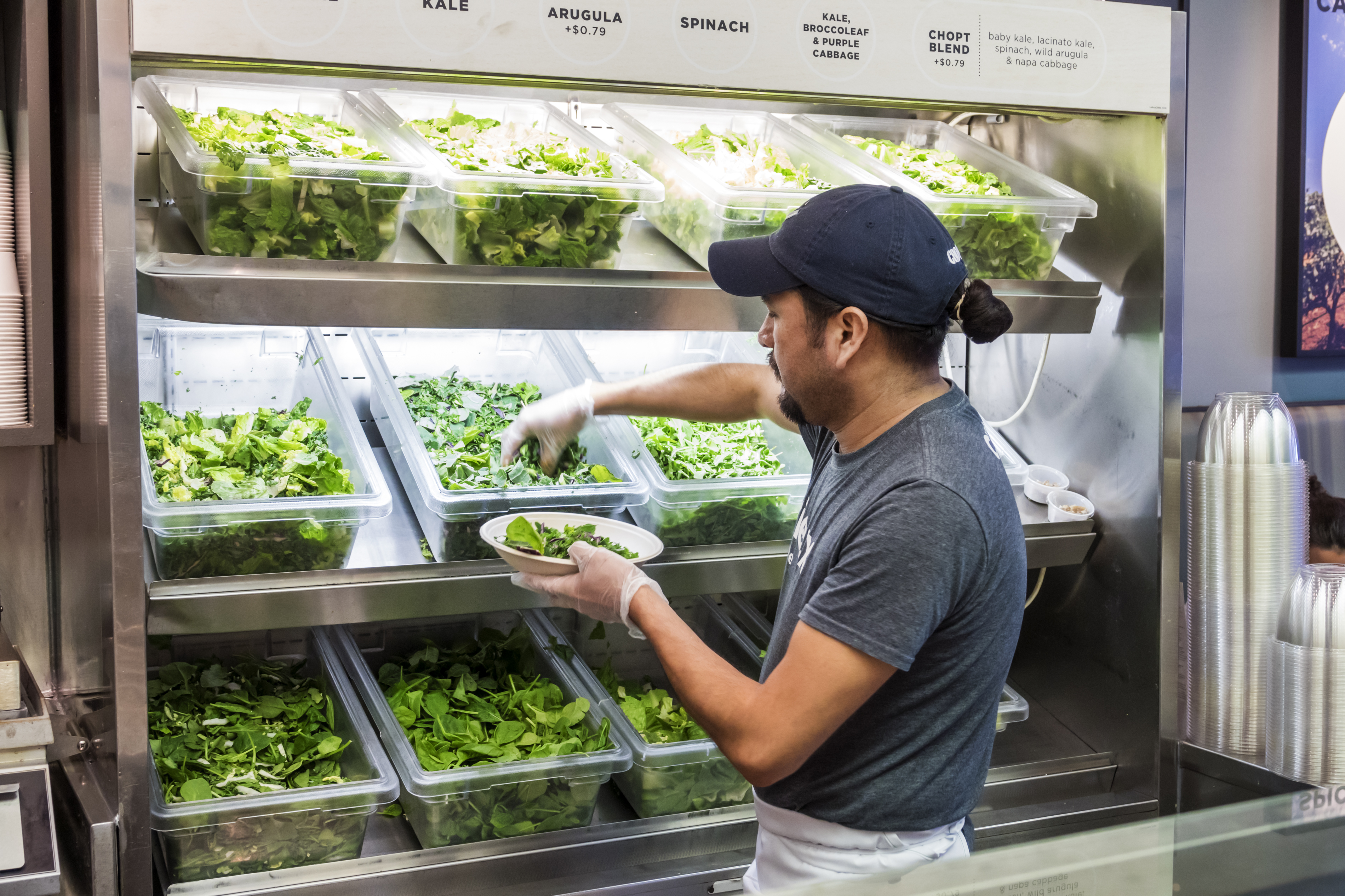 Washington DC, Chinatown, Chop’t, restaurant server getting greens for salad preparation