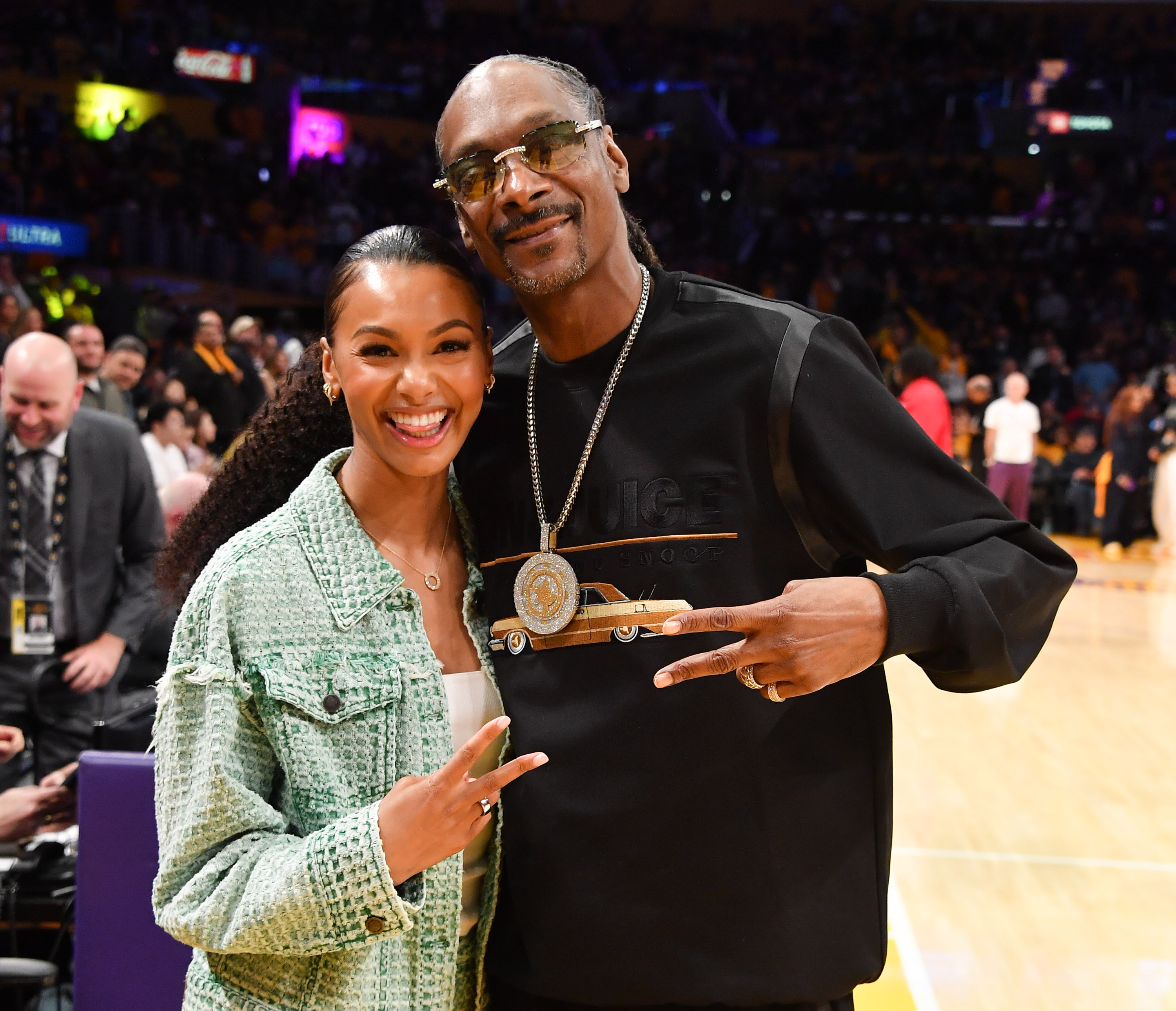 Malika Andrews and Snoop Dogg attend a basketball game between the Los Angeles Lakers and the Denver Nuggets at Crypto.com Arena on April 25, 2024 in Los Angeles, California.