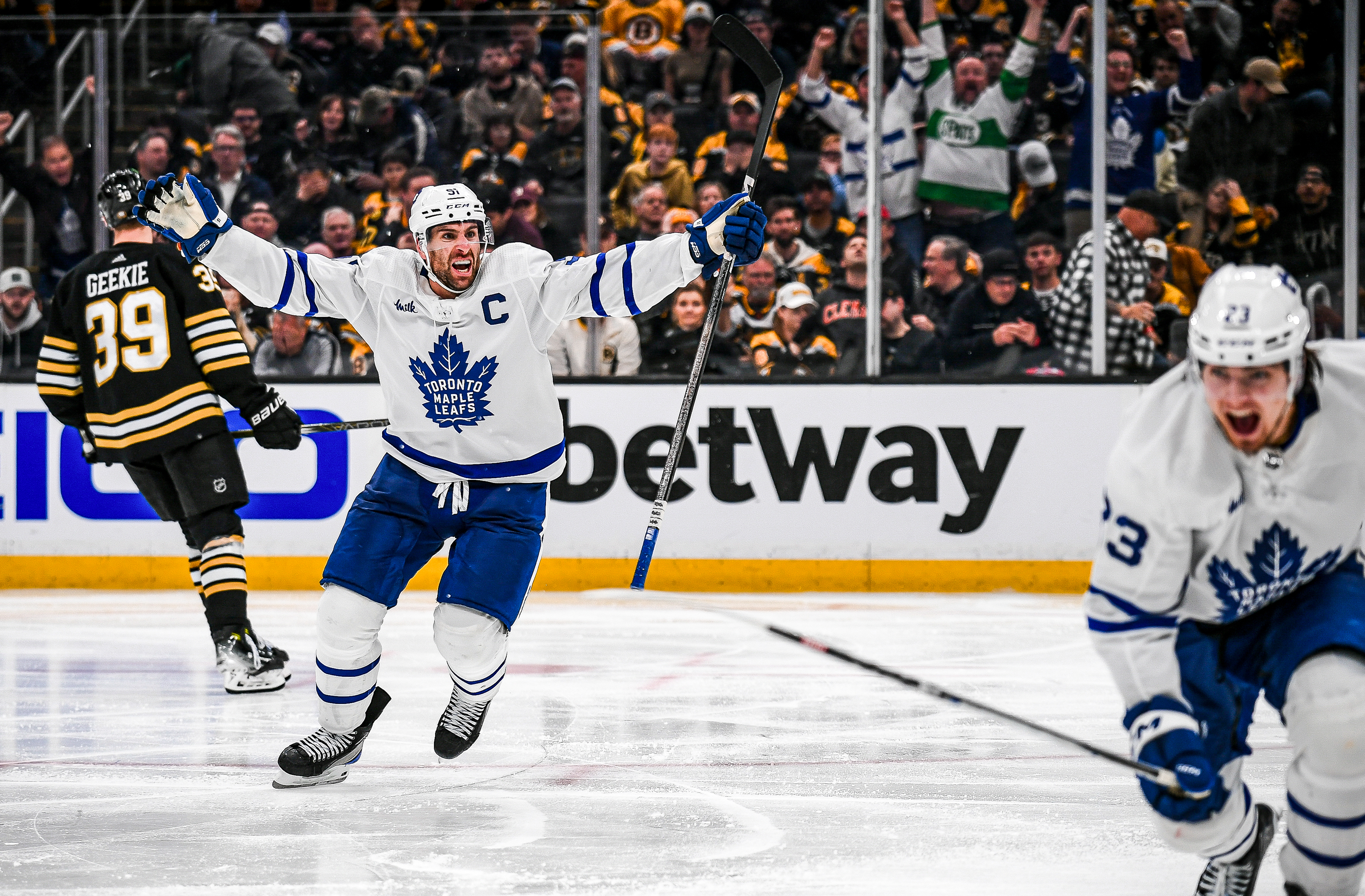 John Tavares of the Toronto Maple Leafs celebrates teammate Matthew Knies over time winning goal against the Boston Bruins in Game Five of the First Round of the 2024 Stanley Cup Playoff at TD Garden on April 30, 2024 in Boston, Massachusetts.