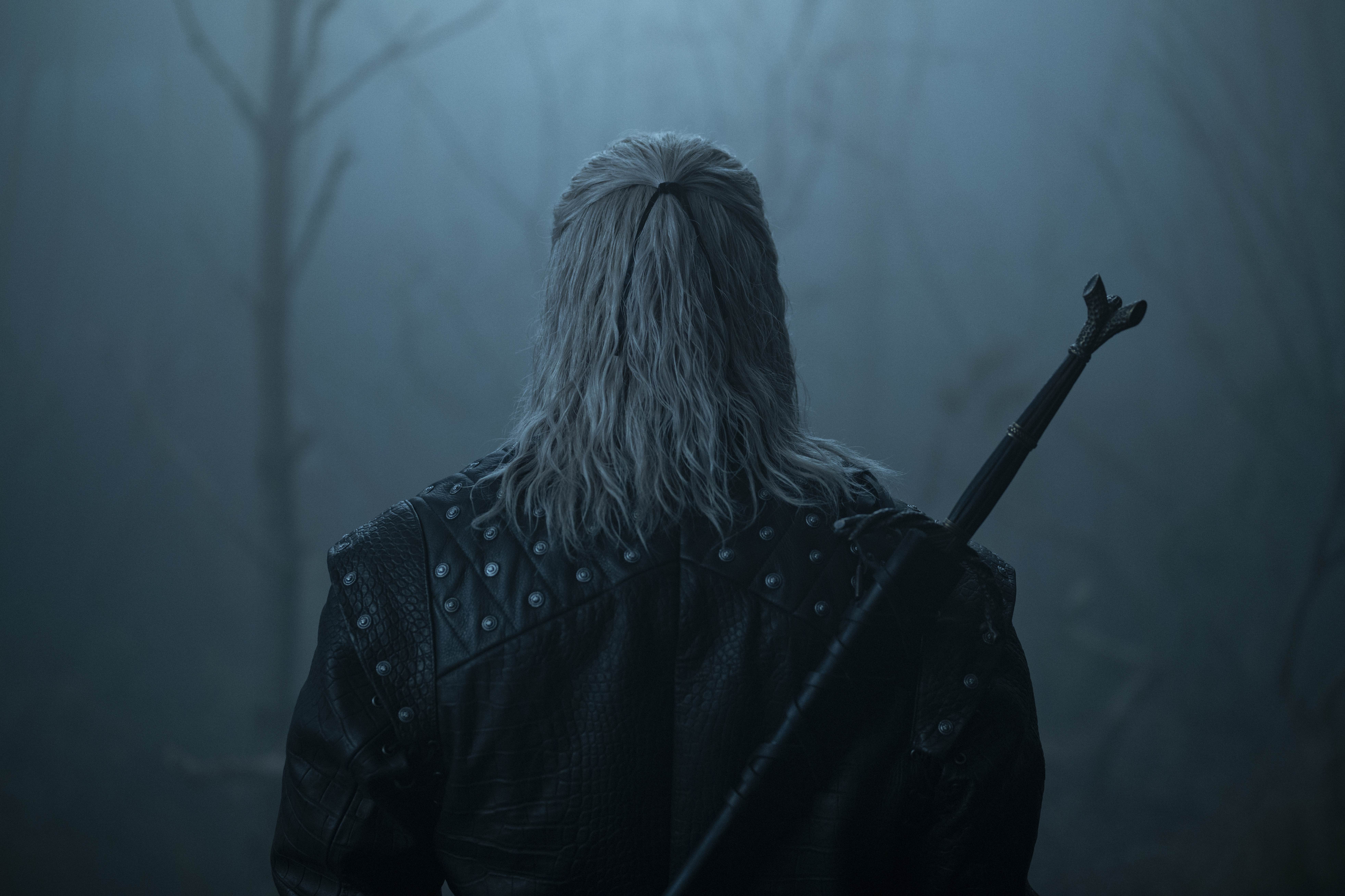 Liam Hemsworth as Geralt in Netflix’s The Witcher, shown very sneakily from behind.