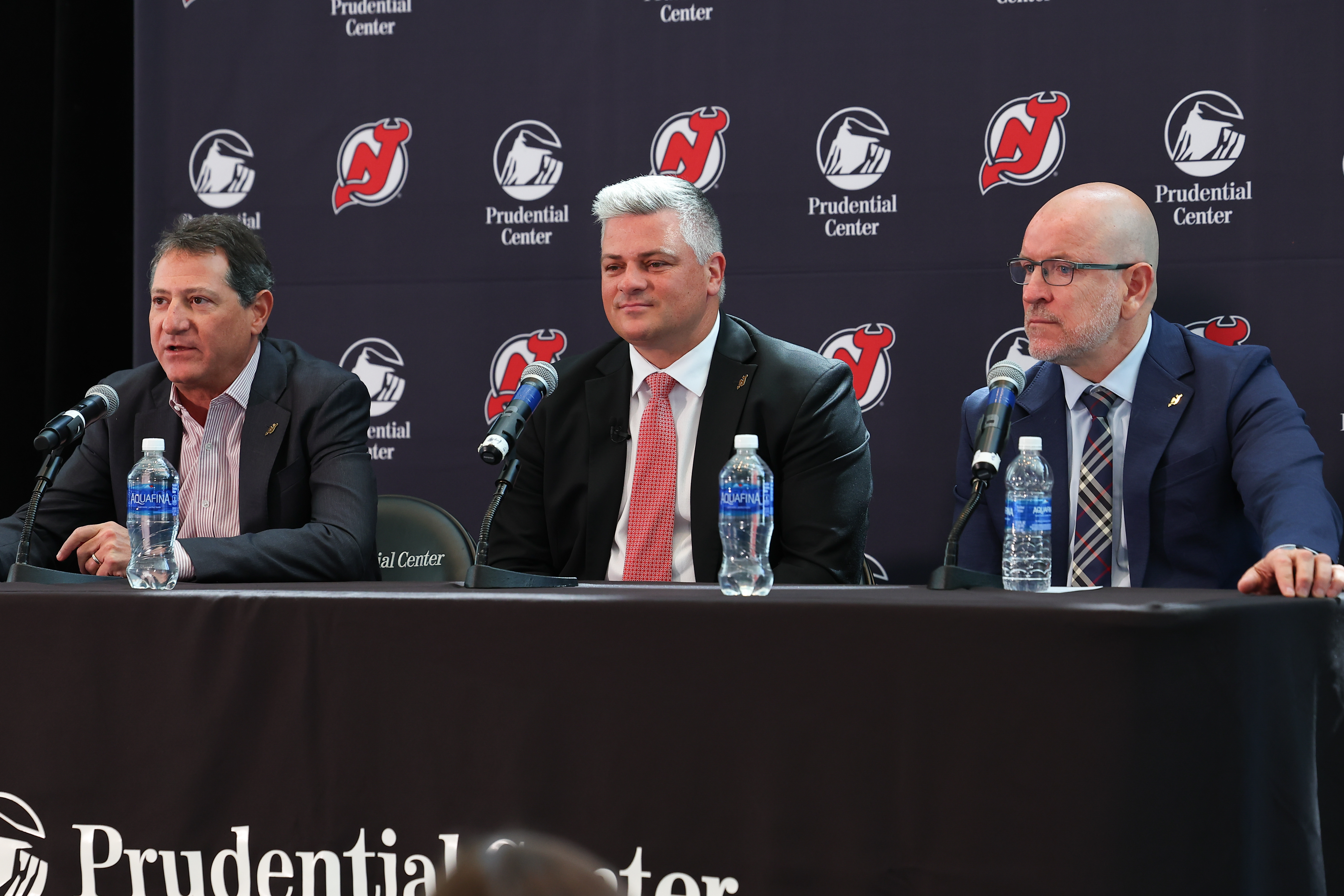 David Blitzer Managing partner of the New Jersey Devils speaks during the introduction of Sheldon Keefe as New Jersey Devils head coach and Tom Fitzgerald General Manager of the New Jersey Devils looks on at the Prudential Center on May 28, 2024 in Newark, New Jersey.