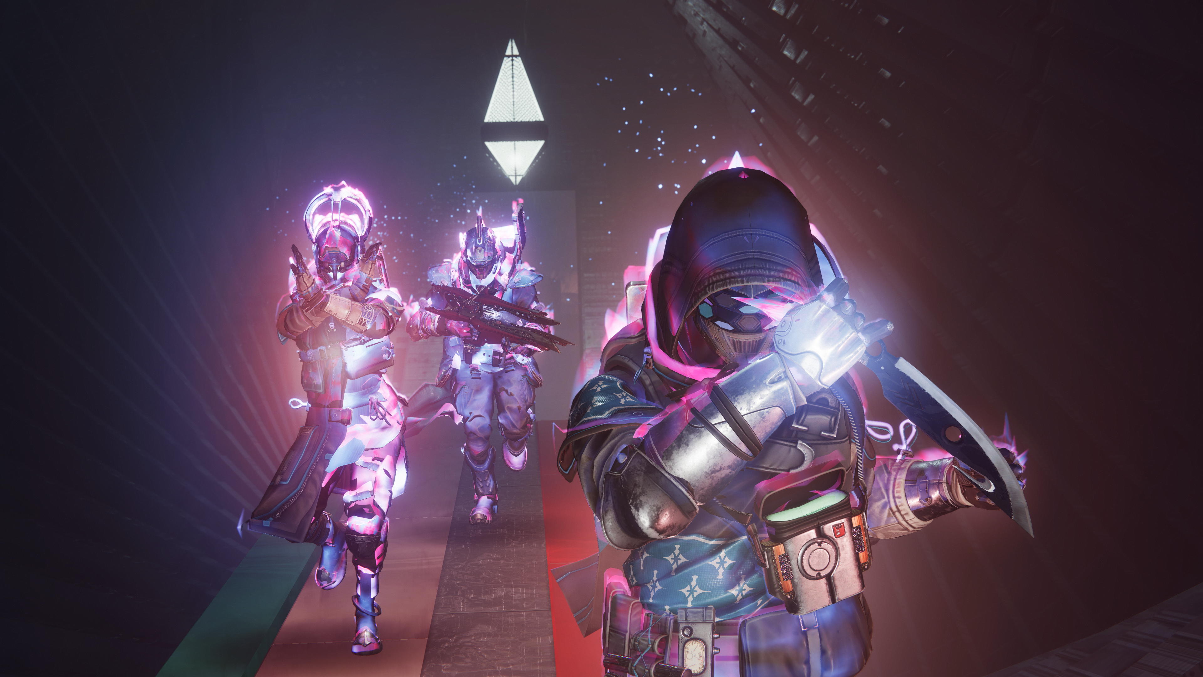 Three Guardians wielding a Prismatic subclass walk forward in Destiny 2