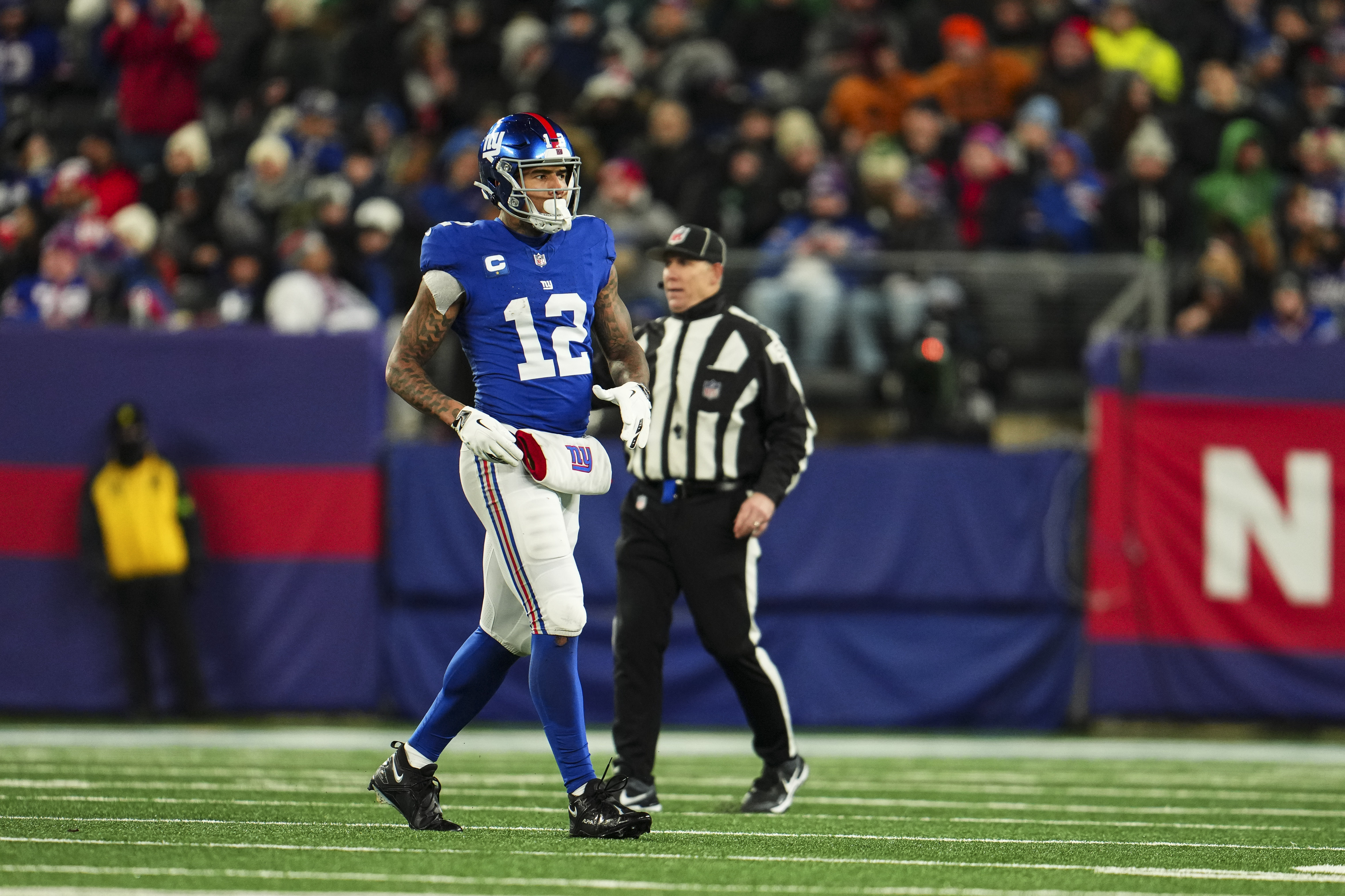 Darren Waller #12 of the New York Giants looks on from the field during an NFL football game against the Philadelphia Eagles at MetLife Stadium on January 7, 2024 in East Rutherford, New Jersey.