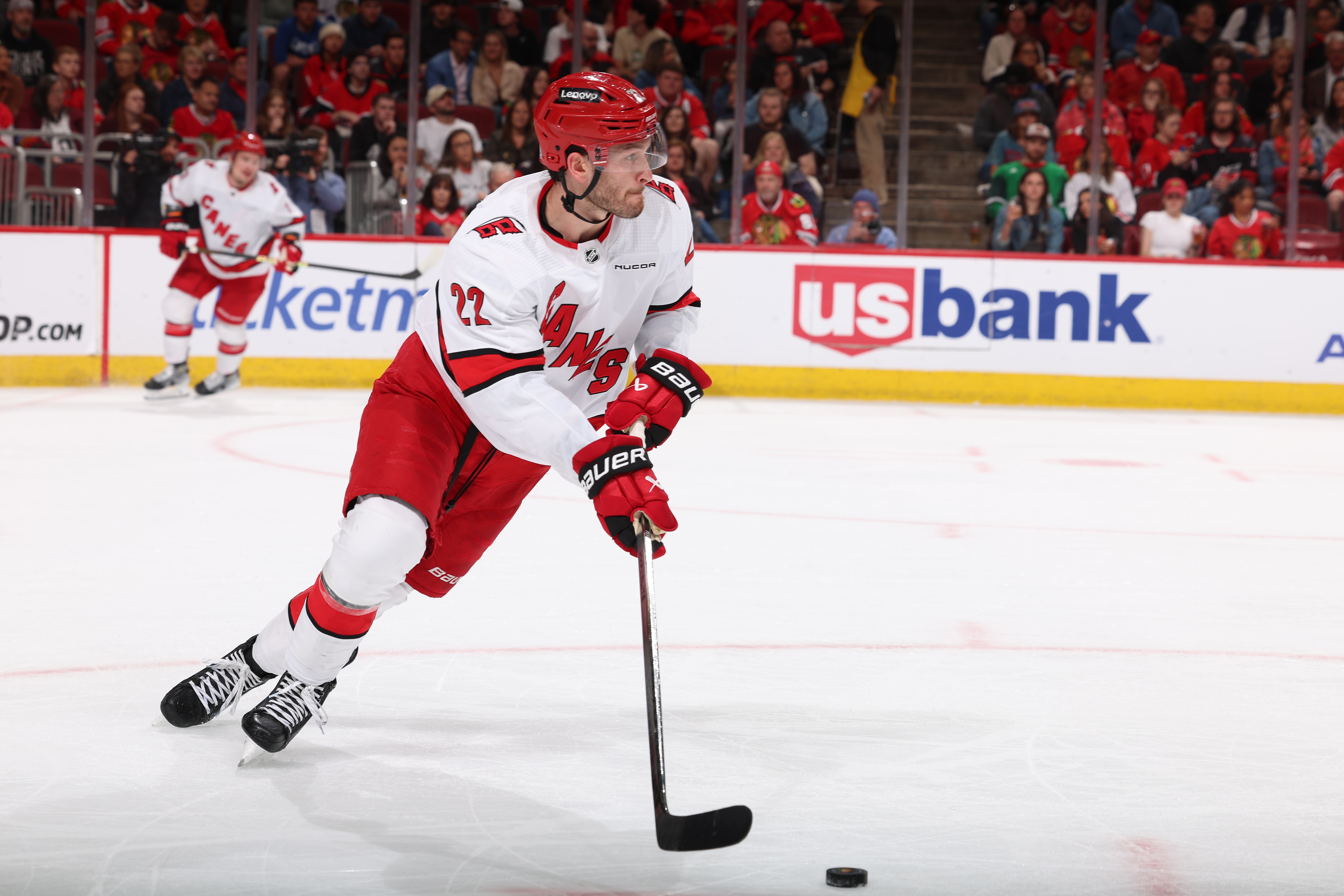 Brett Pesce of the Carolina Hurricanes looks to take the puck up the ice in the second period \abh at the United Center on April 14, 2024 in Chicago, Illinois.