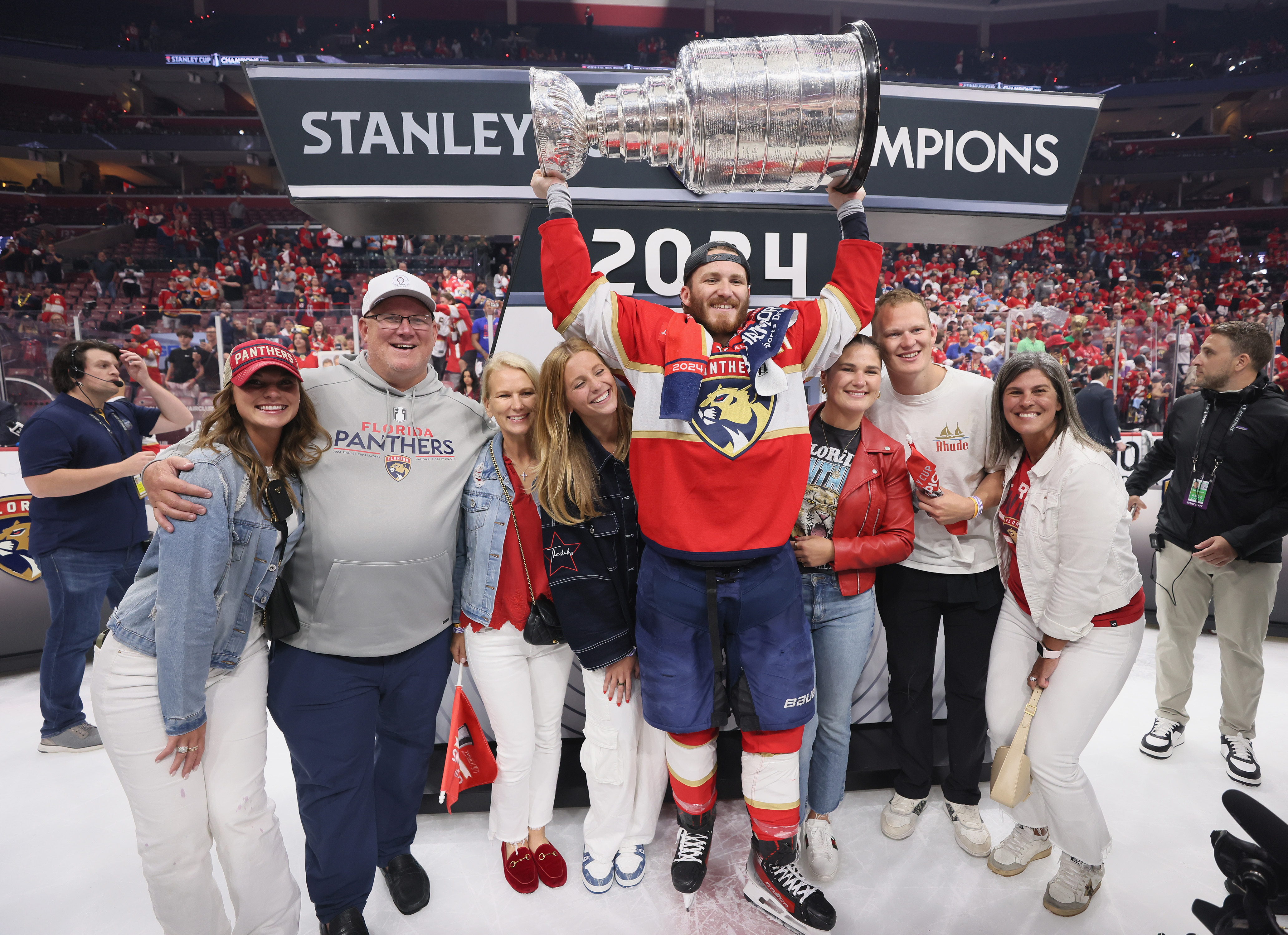 The Tkachuk family celebrates with the Stanley Cup following a 2-1 victory over the Edmonton Oilers in Game Seven of the 2024 NHL Stanley Cup Final at Amerant Bank Arena on June 24, 2024 in Sunrise, Florida.