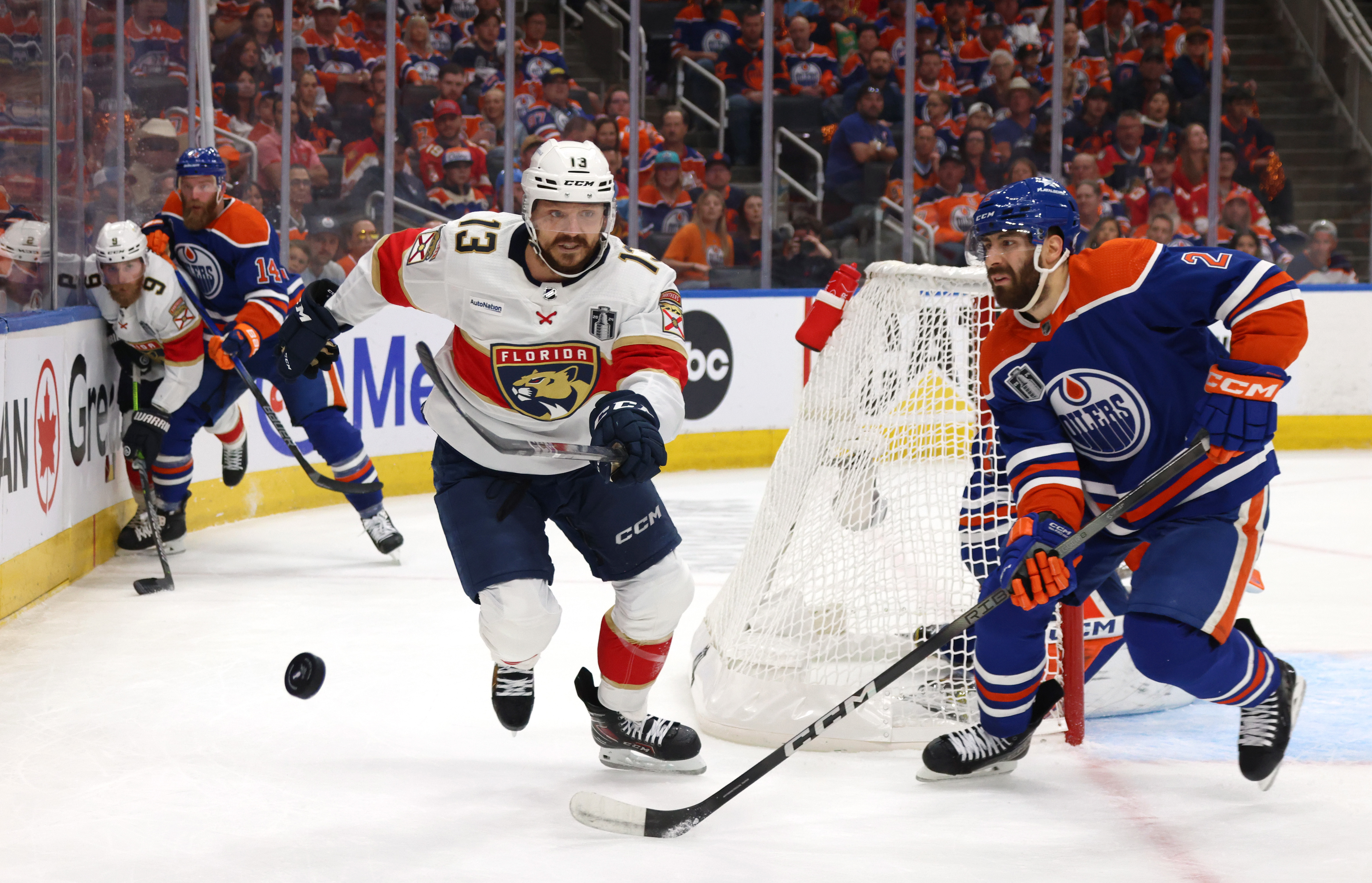 Sam Reinhart of the Florida Panthers and Evan Bouchard of the Edmonton Oilers pursue the puck during the second period of Game Four of the 2024 Stanley Cup Final between the Florida Panthers and the Edmonton Oilers at Rogers Place on June 15, 2024 in Edmonton, Alberta.