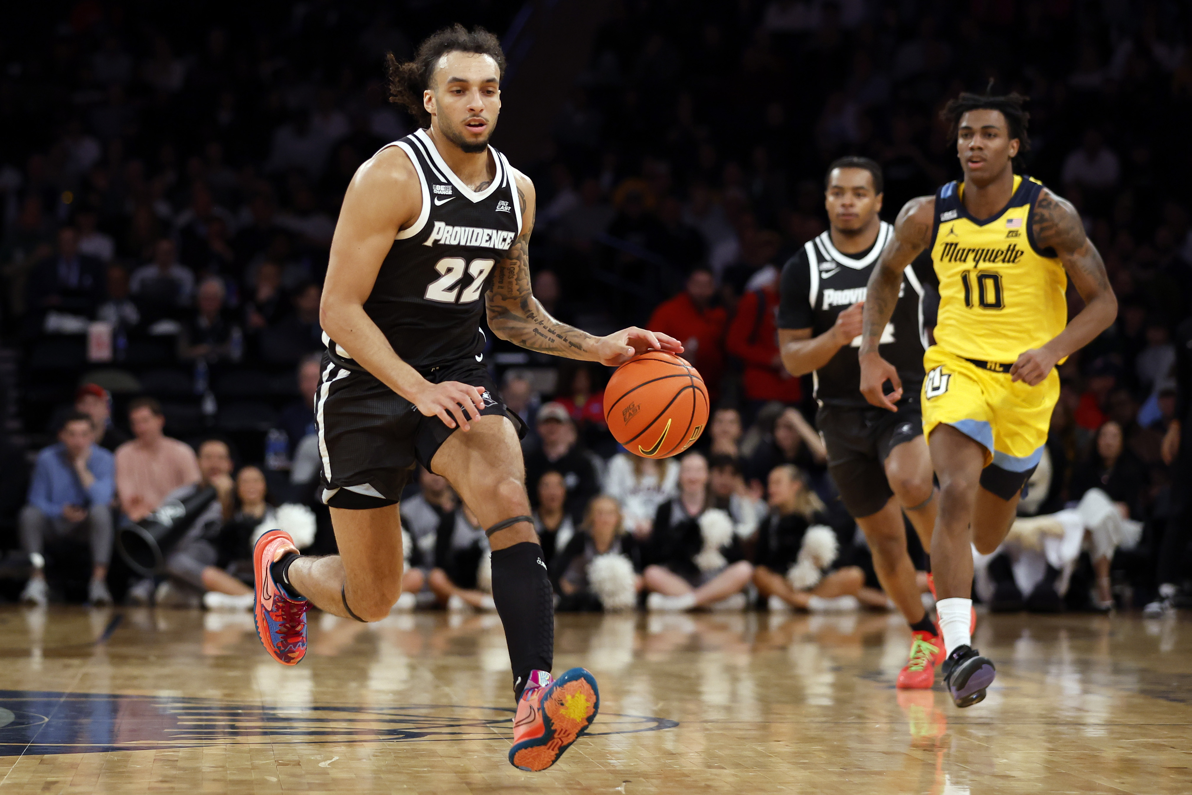 Devin Carter #22 of the Providence Friars dribbles in the first half against the Marquette Golden Eagles during the Semifinal round of the Big East Basketball Tournament at Madison Square Garden on March 15, 2024 in New York City.