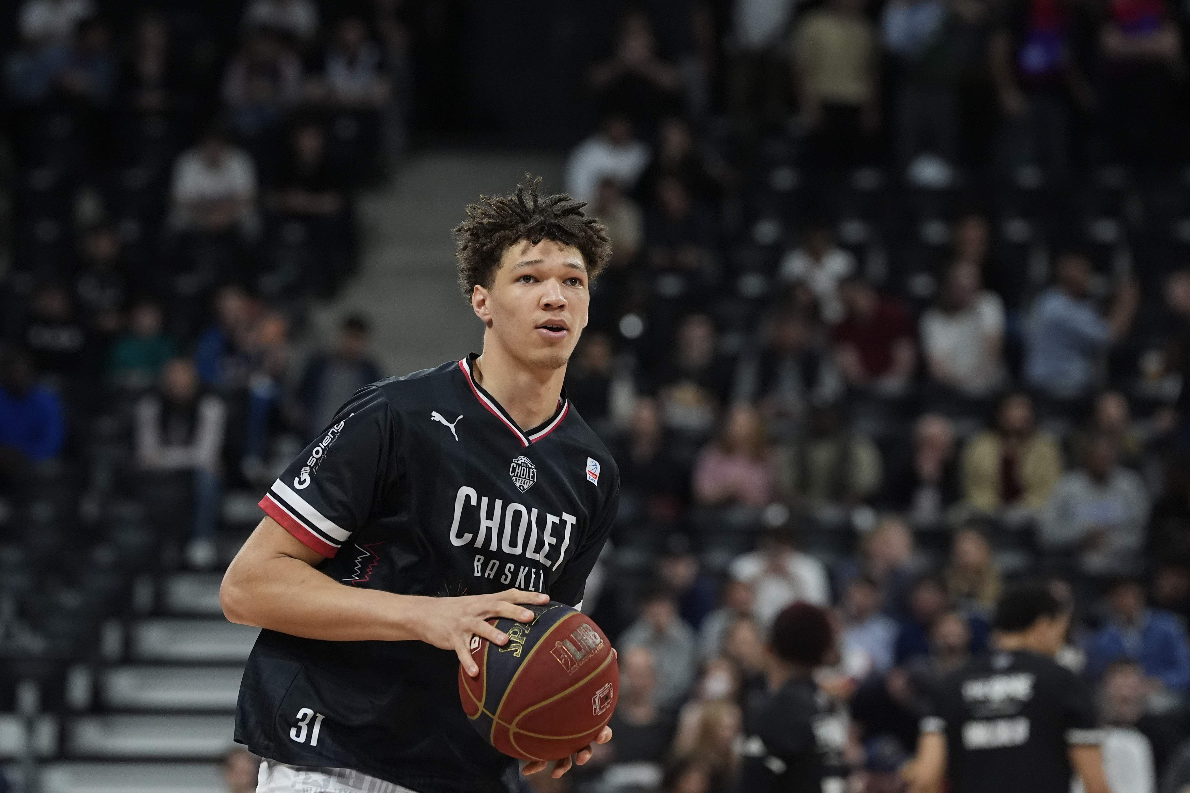 Tidjane Salaun (31) (Cholet) warms up prior to the French National Basketball League (LNB) playoff match between the Paris Basket and the Cholet Basket at Adidas Arena on May 21, 2024 in Paris, France.