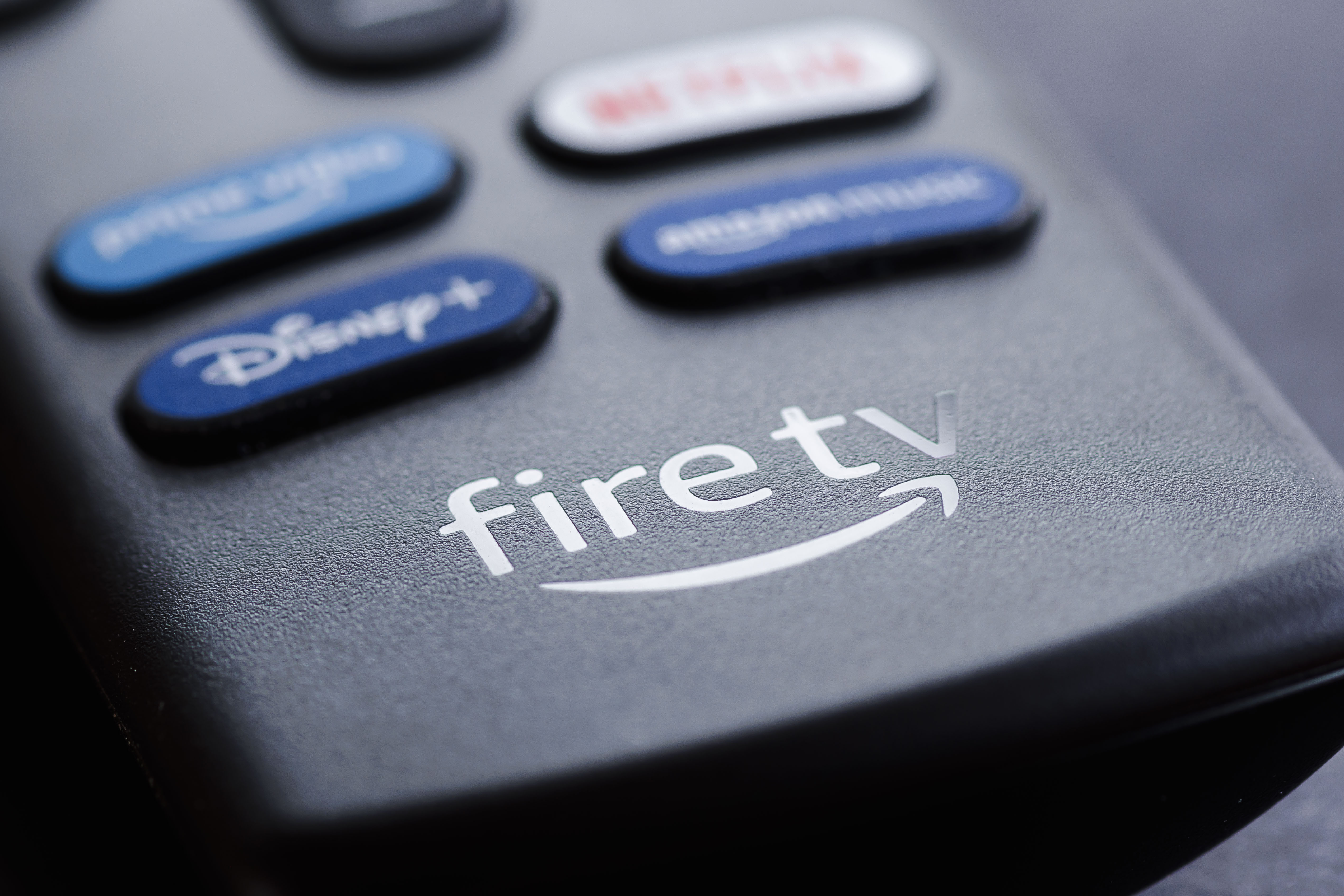 A photograph of the  remote control of an Amazon fire TV stick