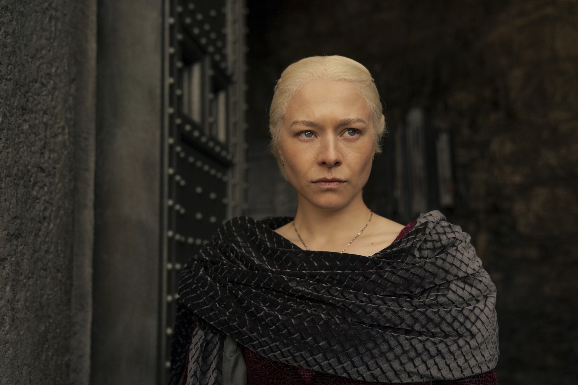 Rhaenyra, in a black power cowl, steps out of a building in episode 3 of House of the Dragon season 2