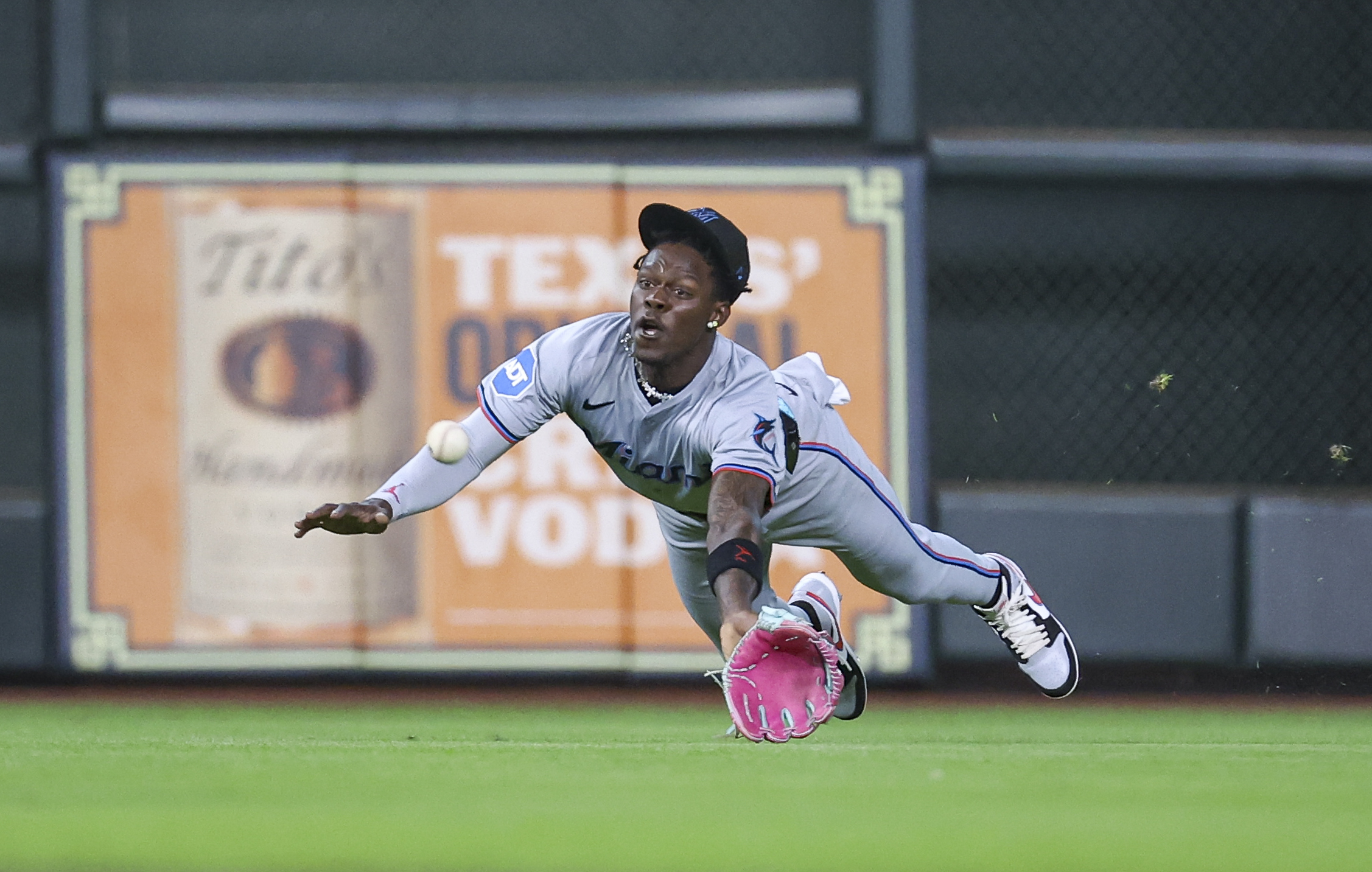 Jazz Chisholm Jr. dives forward in an attempt to catch a line drive in a game against the Astros.