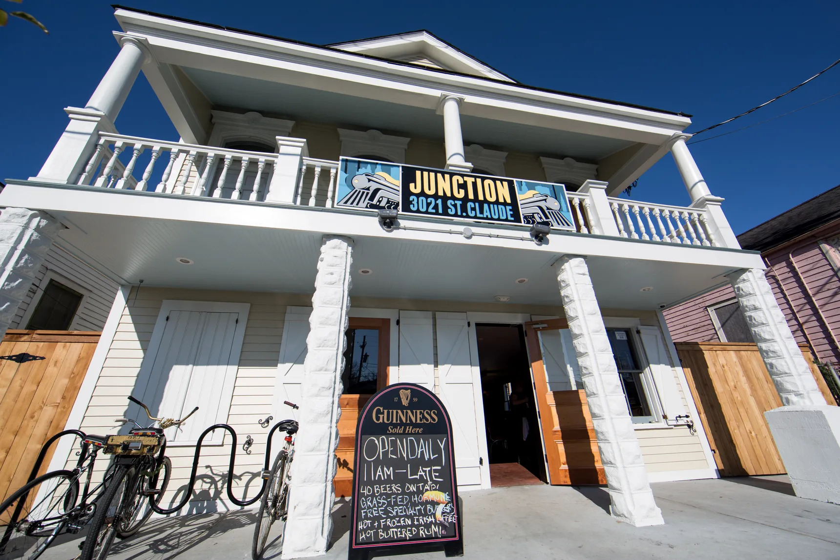 The white, two-story facade of Junction Bar and Grill, a former convenience store on St. Claude Avenue, in 2015.