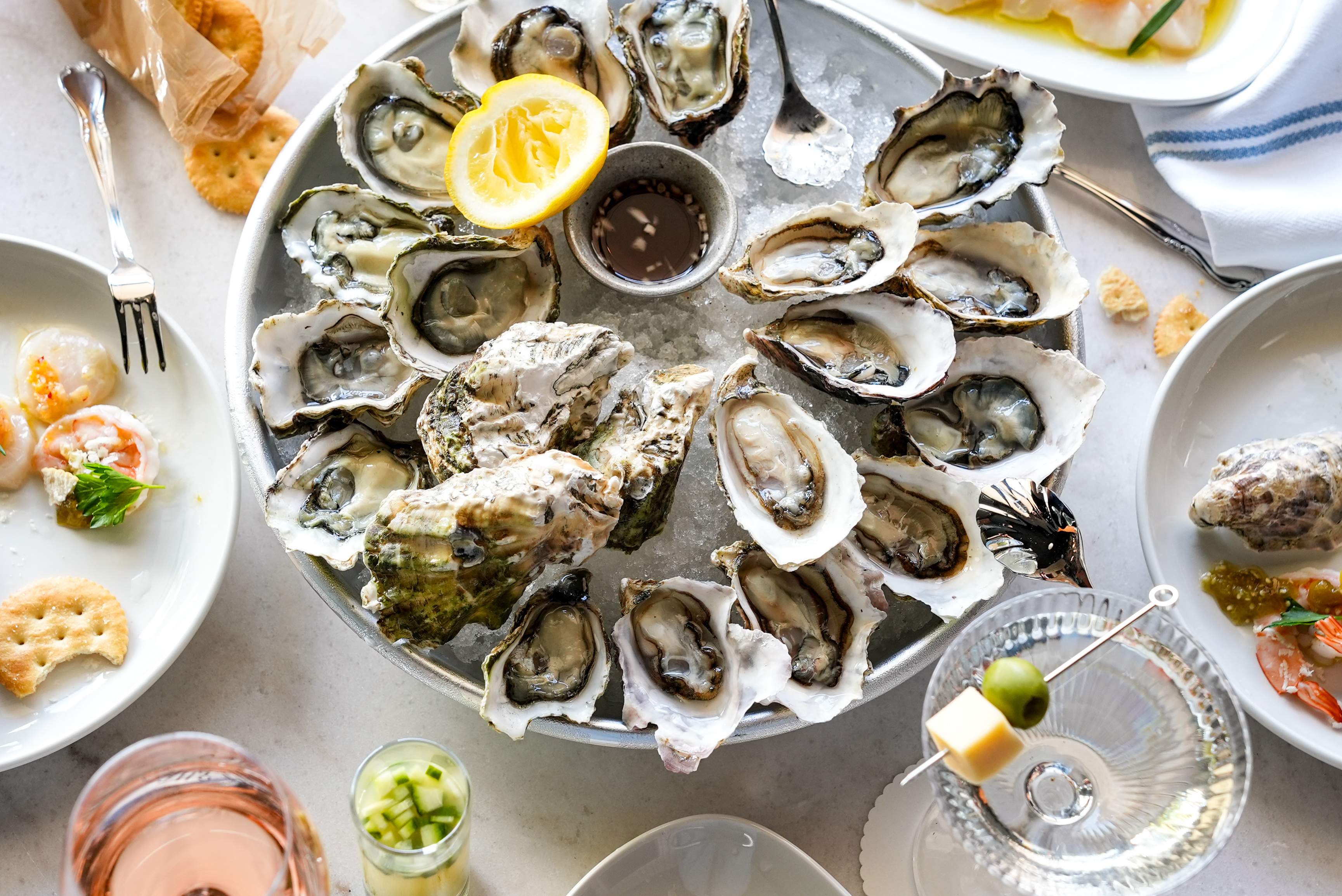 A massive plate of raw oysters.