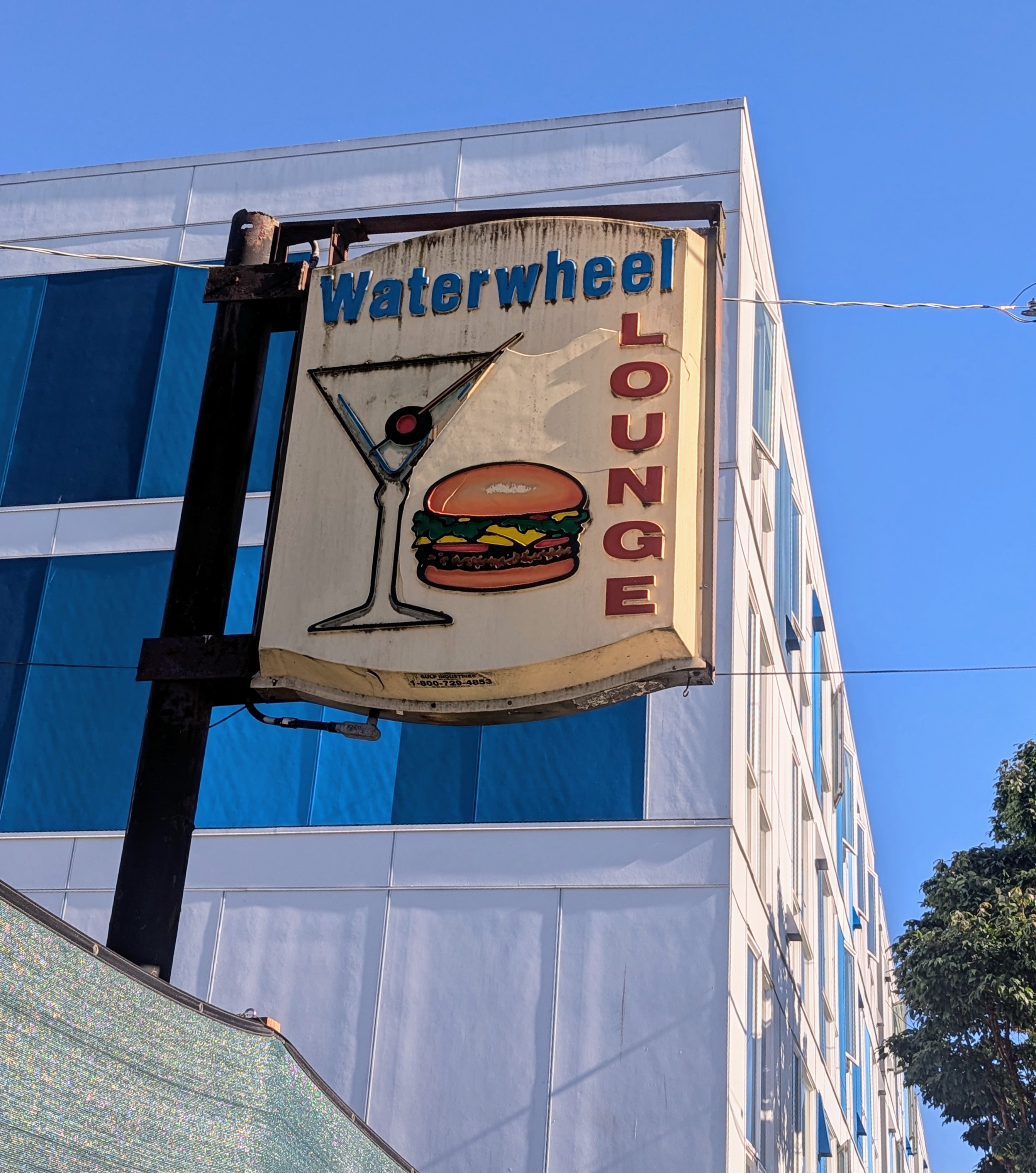 A sign that says Waterwheel Lounge.