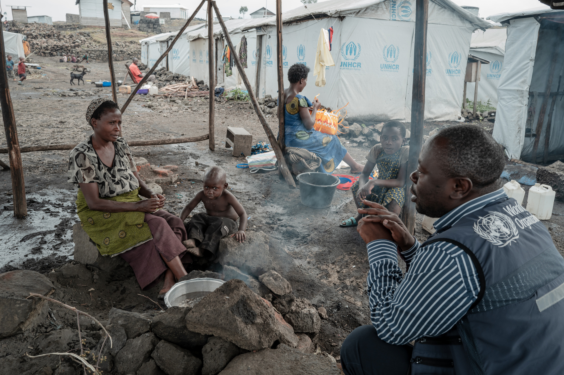 Doctor talks to woman and child