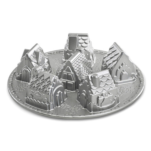 Side view of the Cozy Village Pan. Inside of pan is silver in color and shows six small houses with roof shingles, chimneys, doors details.