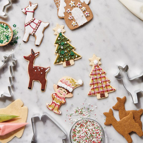 Decorated Christmas Cheer cookies. Elf, deer, tree, and gingerbread house.