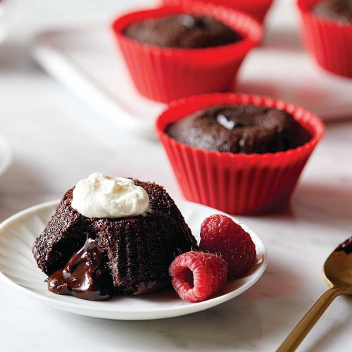 Baked Lava Cake Mix on a plate with whipped cream