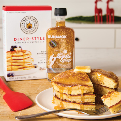 stack of pancakes covered with Sparkling Maple Syrup