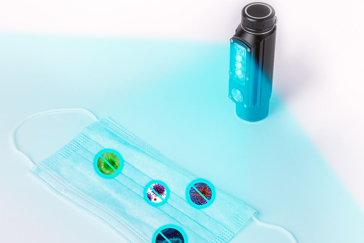 A sanitizing flashlight, with a mask