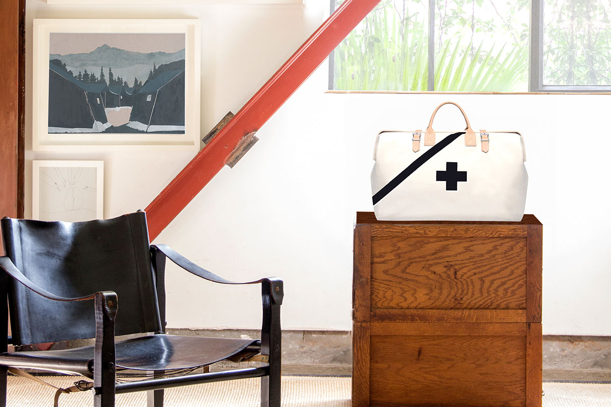 An emergency kit on a side table, next to a chair.