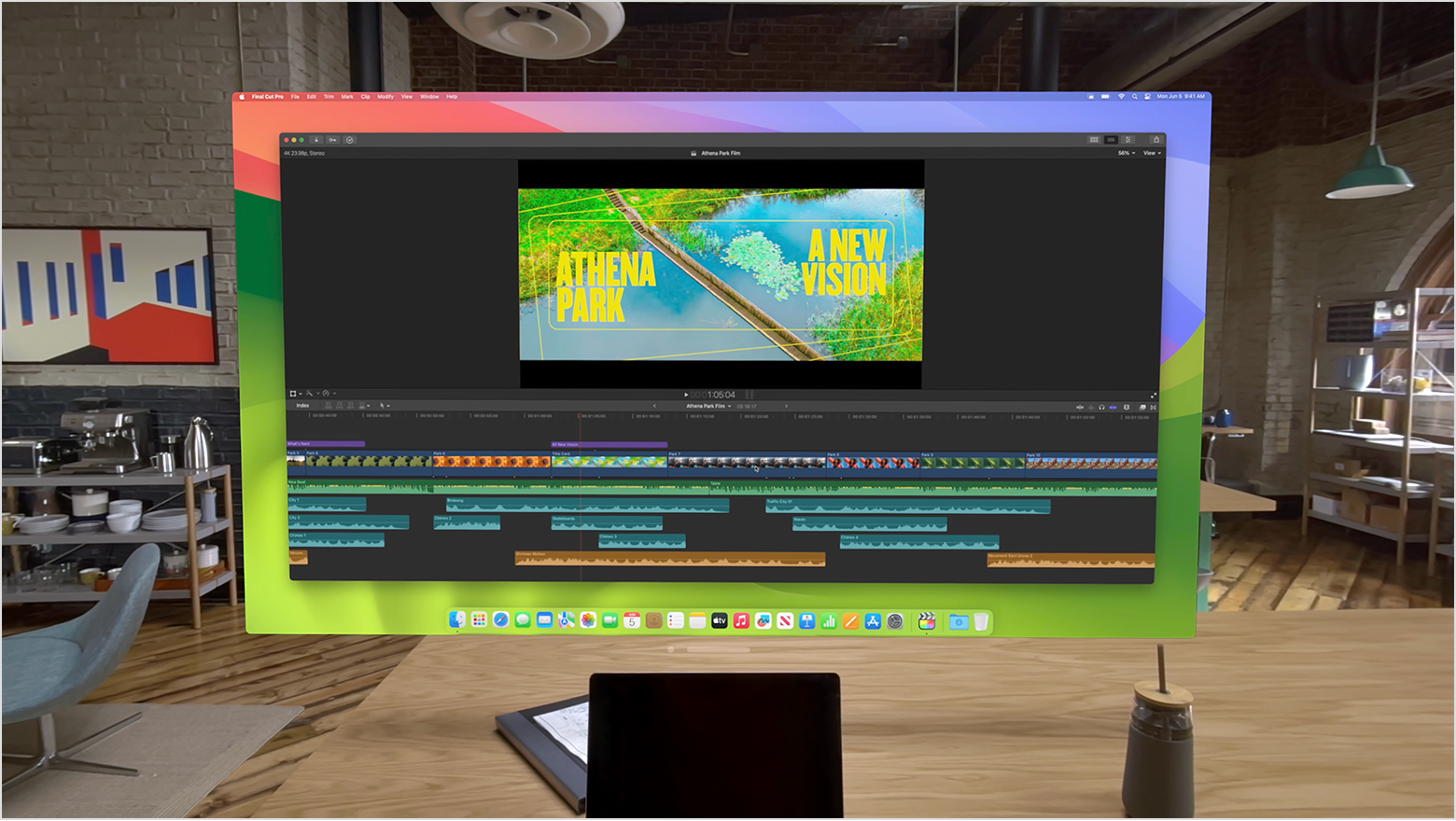 A Mac computer screen appears inside the view of Apple Vision Pro
