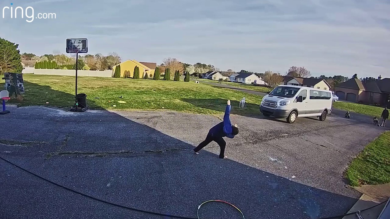 Dad throws football into basketball hoop as son joyously celebrates