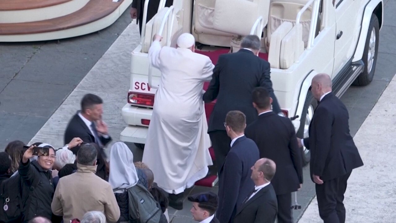 Pope Francis appears unable to climb steps into popemobile