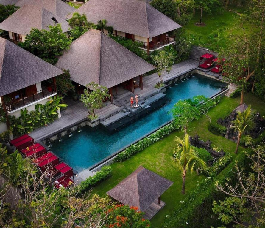 an aerial view of a resort with a swimming pool at La Reserve 1785 Canggu Beach in Canggu