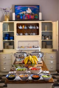 a table with a bunch of bowls of food at The Fifteen Keys Hotel in Rome