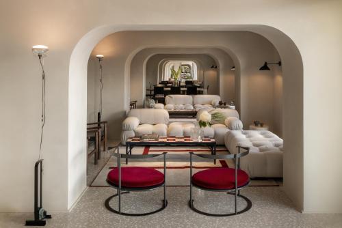 a living room with a couch and a table at La Roqqa in Porto Ercole