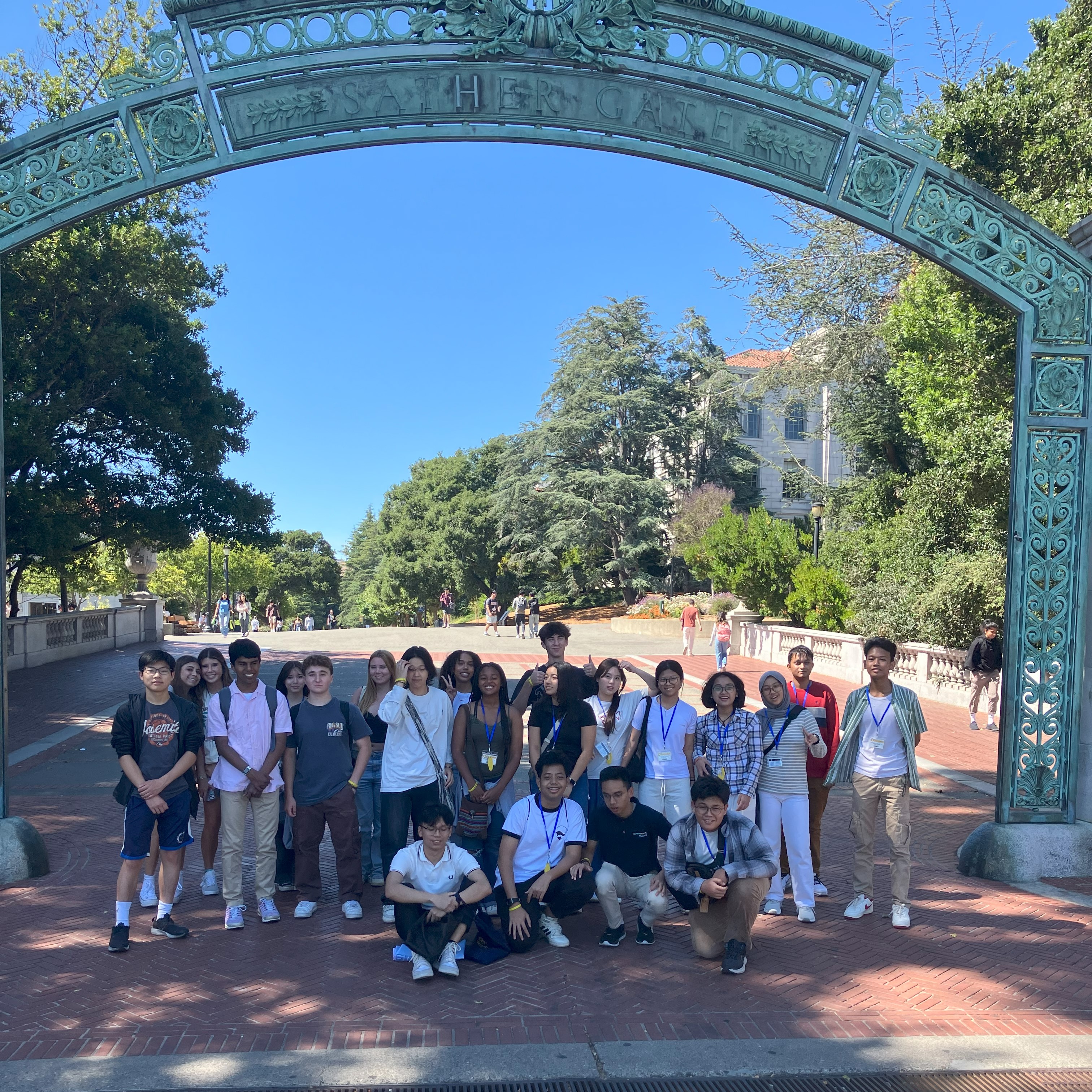 Students posing in front of Sather Gate