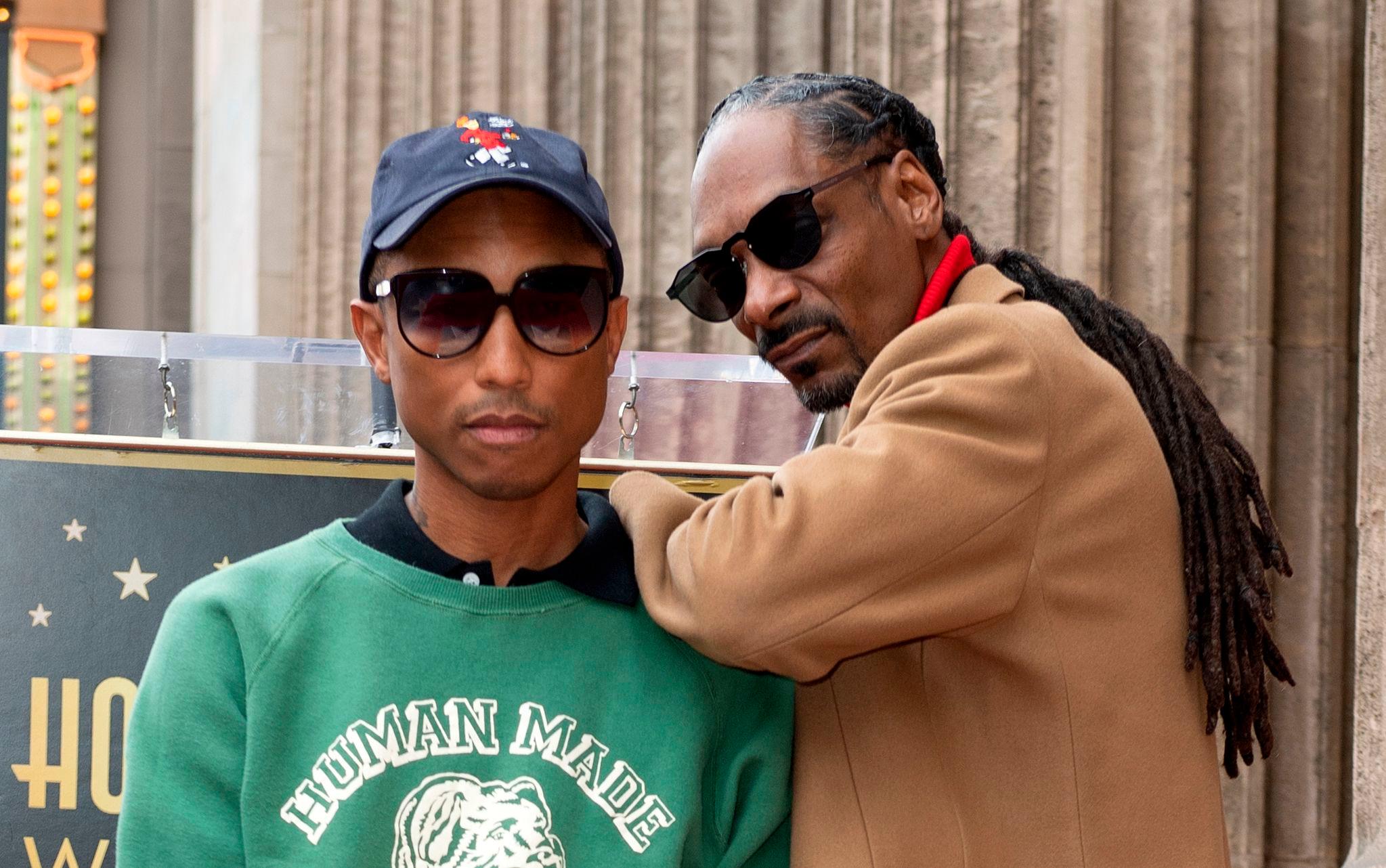 Ici en novembre 2019, les rappeurs Pharrell Williams et Snoop Dogg. Ils porteront la flamme olympique à Saint-Denis (Seine-Saint-Denis) ce vendredi 26 juillet. AFP/Valérie Macon