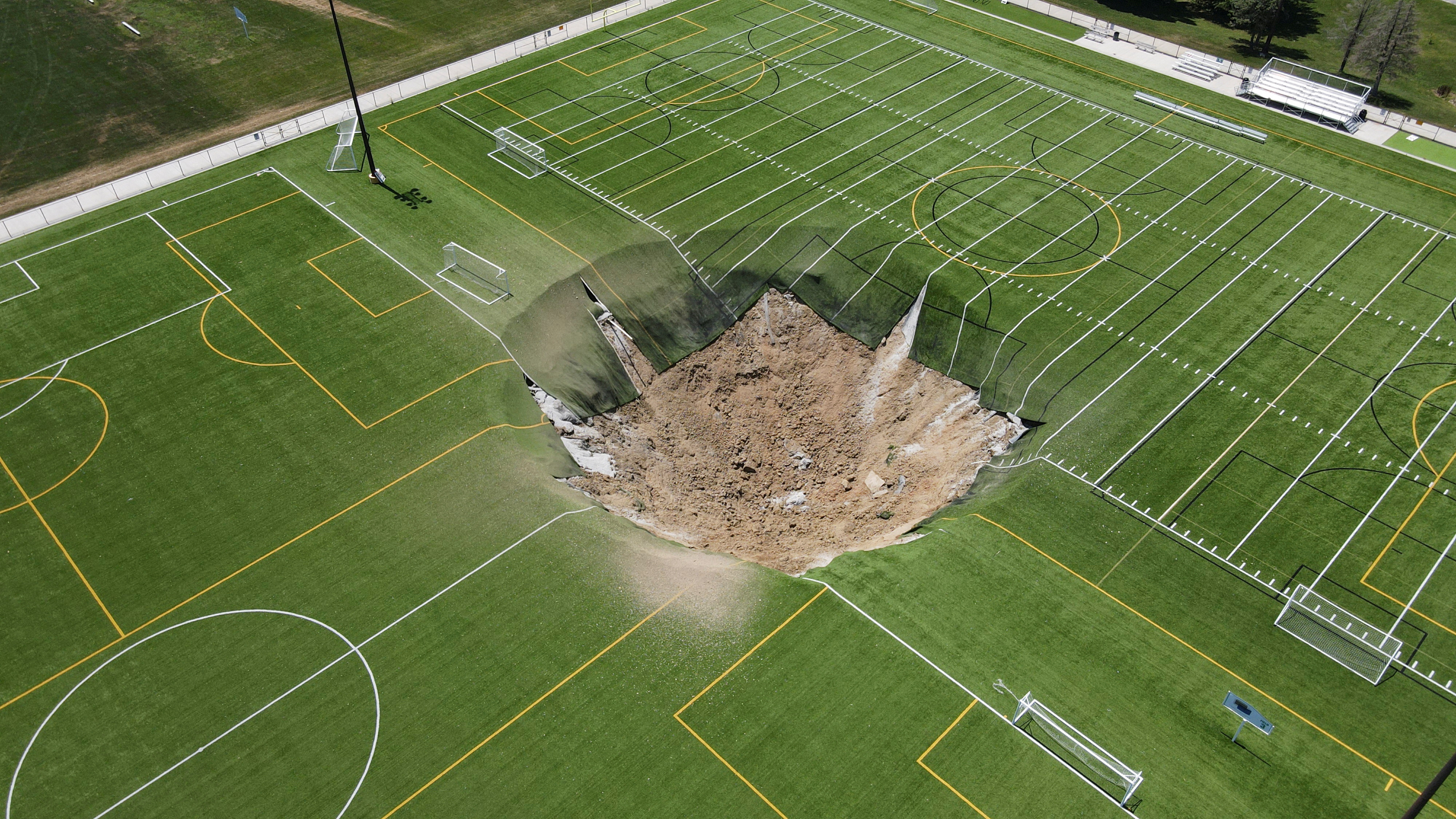 A sinkhole forms on a soccer field in Illinois