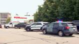 Police officer thrown into air after being struck by car at busy Burlington shopping plaza