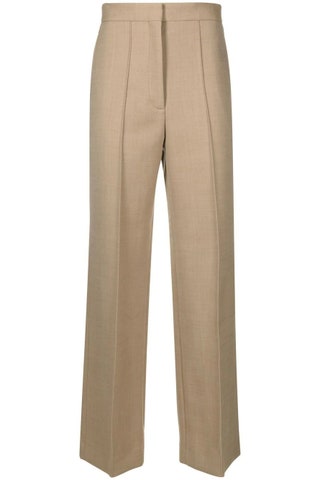 Pantaloni beige a vita alta con riga centrale e gamba morbida.  buttongroup  159 €  Compra ora su farfetch