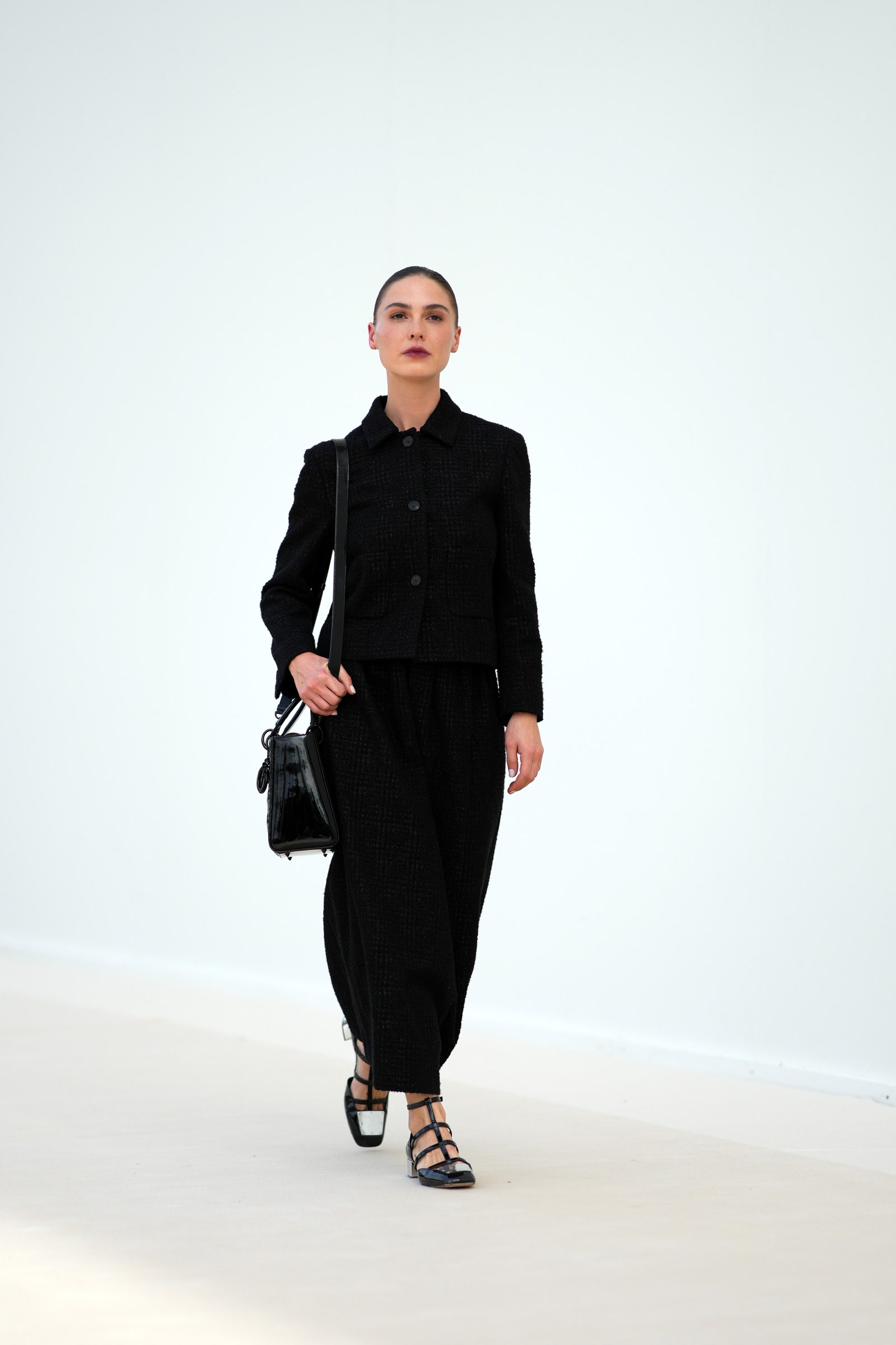 PARIS FRANCE  SEPTEMBER 26 Sophia Roe wears a black long tweed dress a leather bag lace up shoes outside Dior during the...