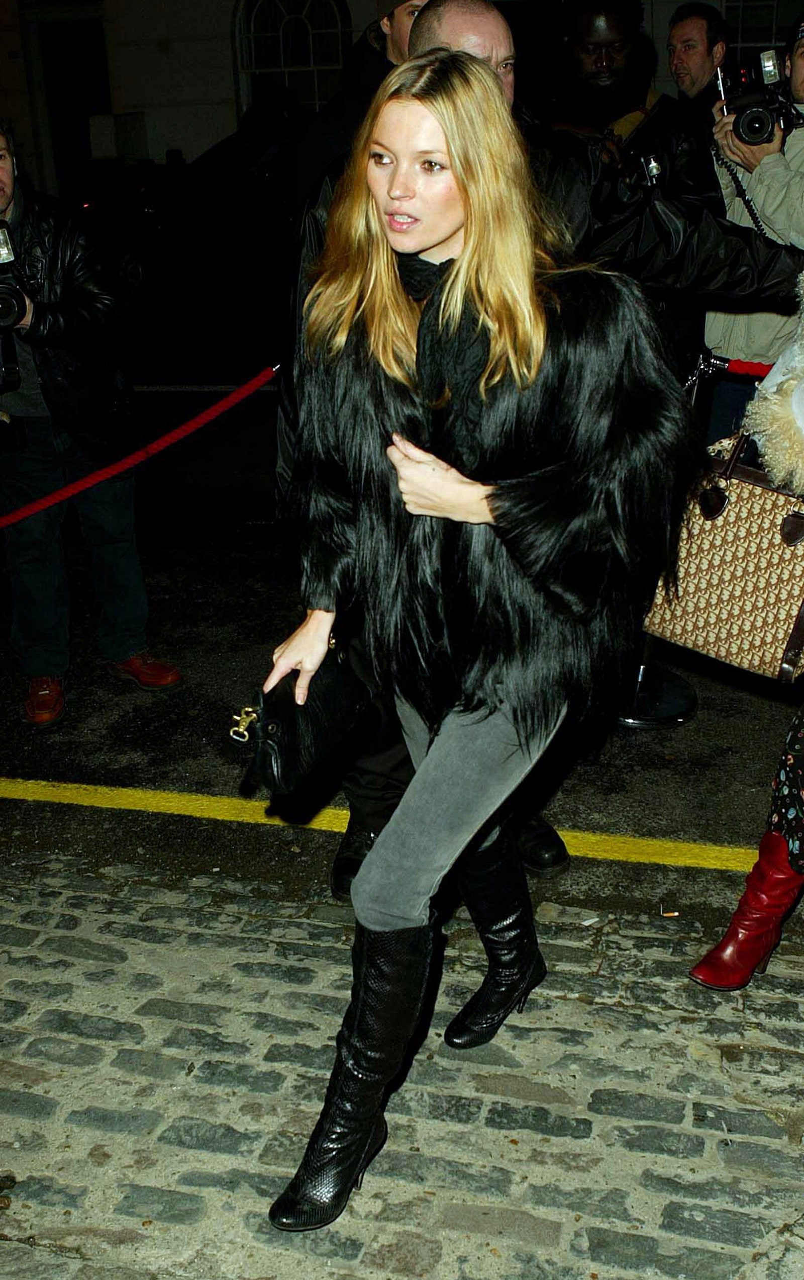 Image may contain Kate Moss Clothing Footwear Shoe Coat Adult Person Accessories Bag Handbag High Heel and Camera