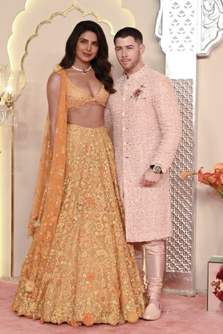 Indian actress Priyanka Chopra Jonas  and her husband American singersongwriter and actor Nick Jonas  pose for photos as...