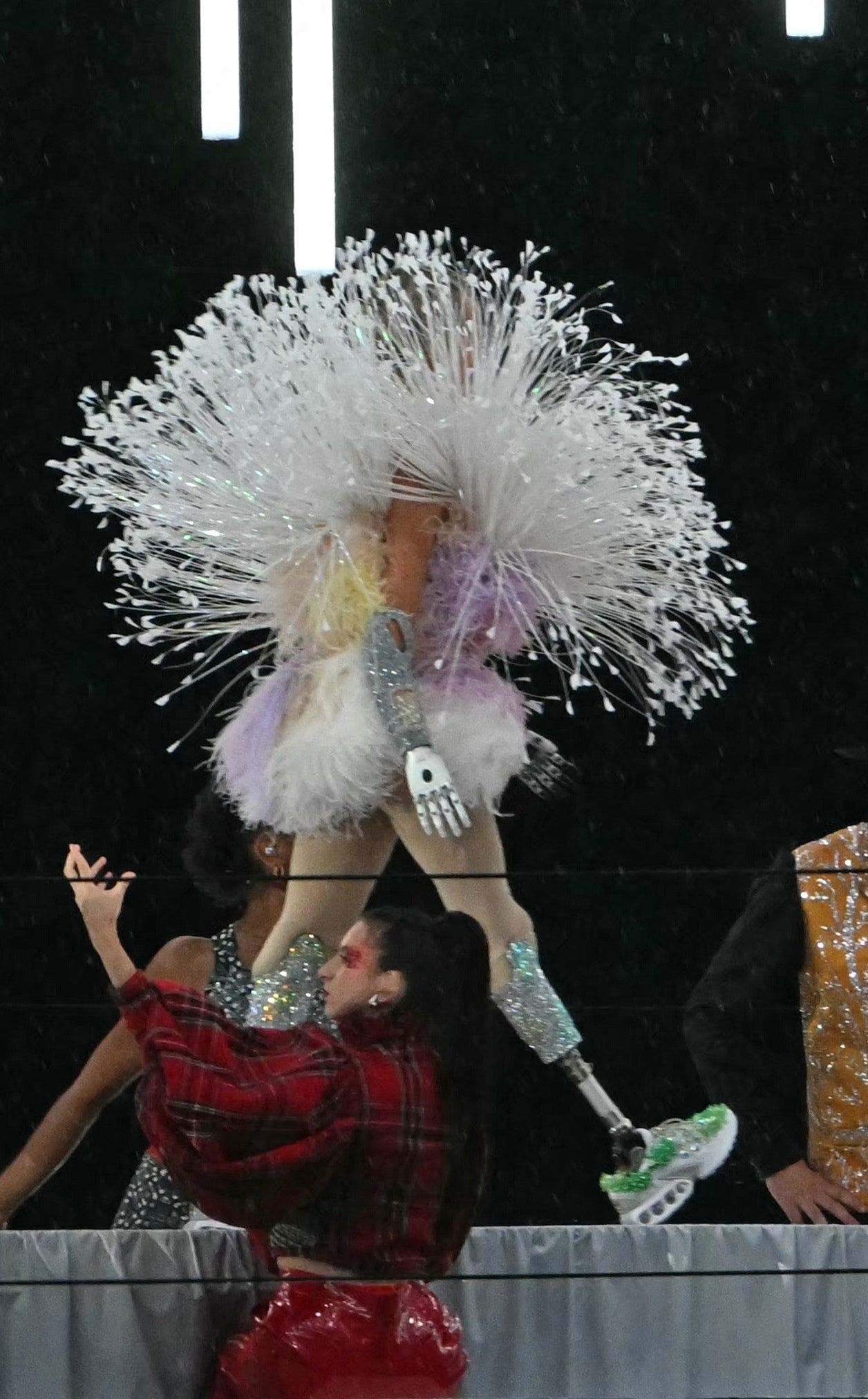 A fashion model displays creations while walking a catwalk erected along the Passerelle Debilly bridge on the Seine...