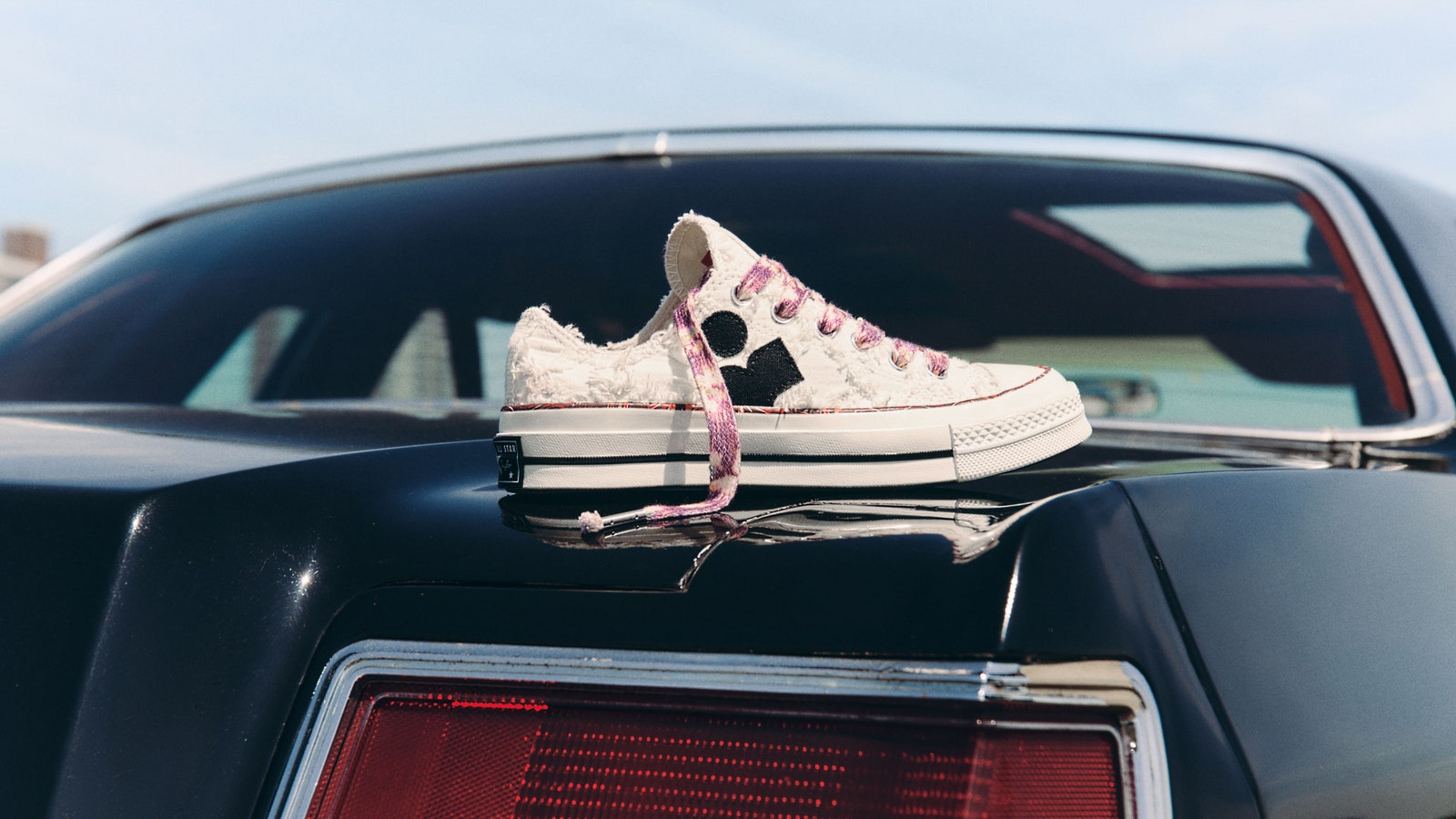 Image may contain Clothing Footwear Shoe Sneaker Car Transportation and Vehicle