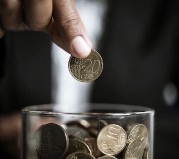 Businessman GIving Money Donation Charity Concept