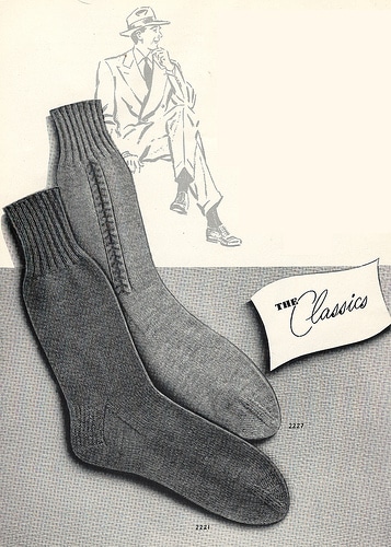 A pair of grey socks perfect for a man's guide to style, featuring a man in a suit.