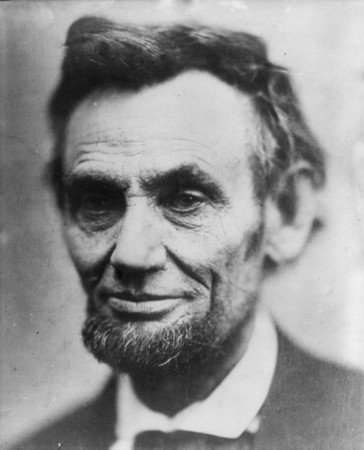 A portrait of Abraham Lincoln, bathed in soft and gentle light, illuminating his dignified expression.