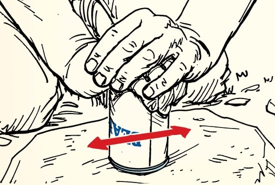 A drawing of two hands crushing an aluminum can on the ground with a red arrow indicating the direction of force, demonstrating how to open a can without a can opener.