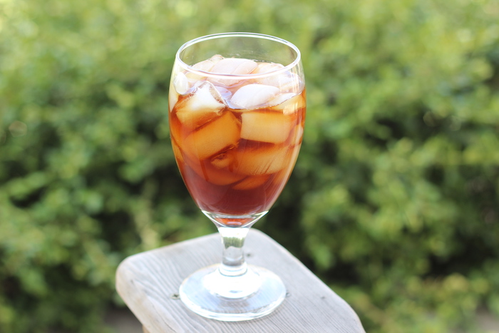 Cold brew coffee with ice cubes served in glass.