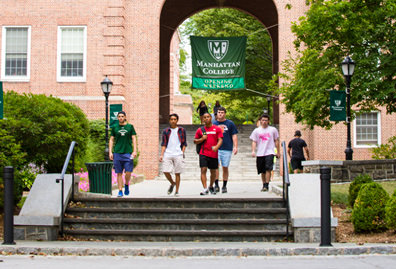 Students walking past archway